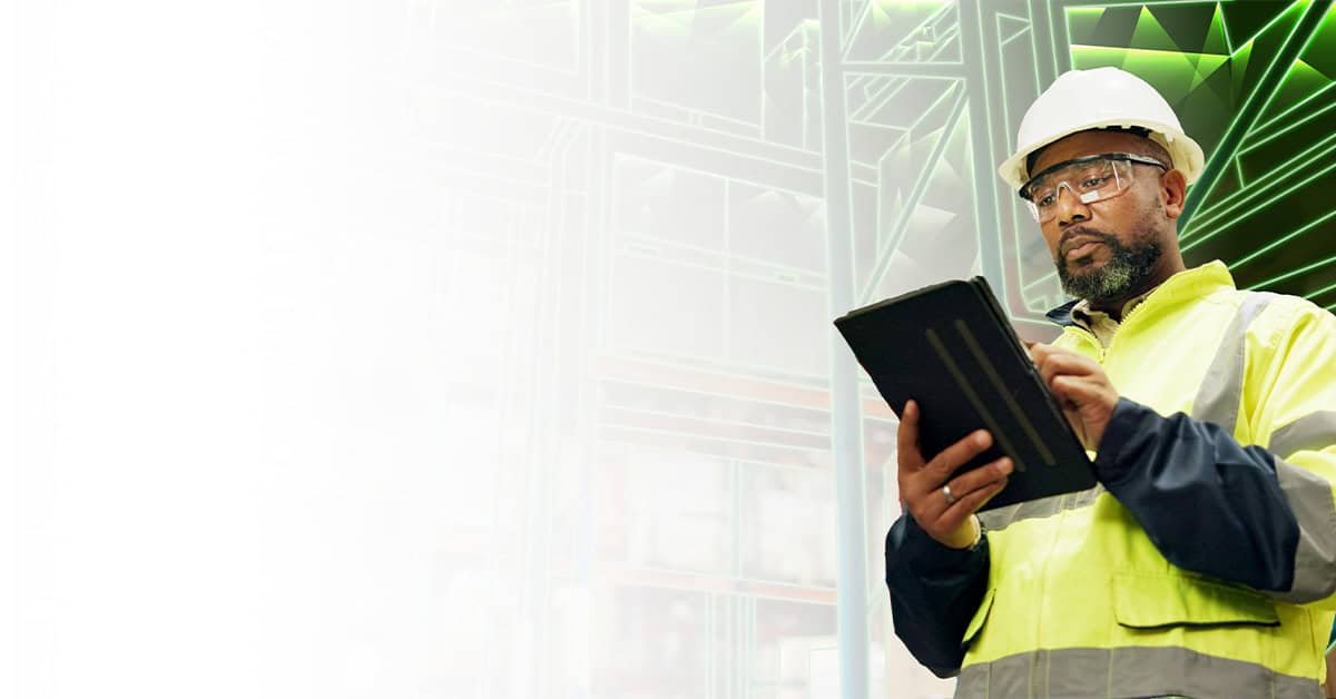 Construction worker looking at ipad